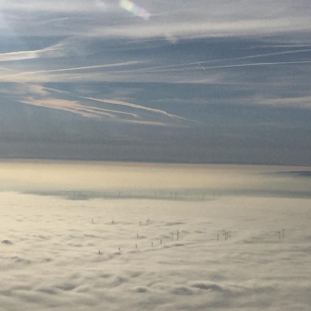 Wind turbines poke through the clouds near Frankfurt